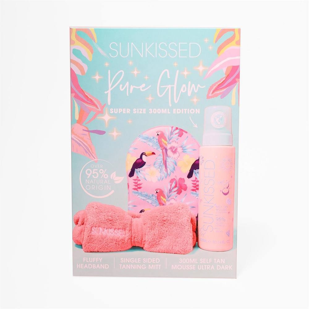 Sunkissed Pure Glow 300ml Ultra Dark tanning mousse in pink packaging, includes a fluffy headband and a single-sided tanning mitt, featuring tropical floral designs.