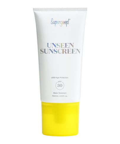 White tube of Supergoop! Unseen Sunscreen SPF 30 with a shiny, reflective label and a bright yellow cap, featuring UVB protection and water-resistant details.