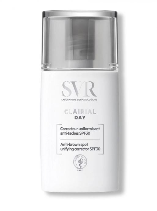 White cylindrical bottle with a clear pump top, labeled "SVR Clairial Day SPF30," featuring a minimalist design and black text, indicating it's an anti-brown spot unifying corrector.