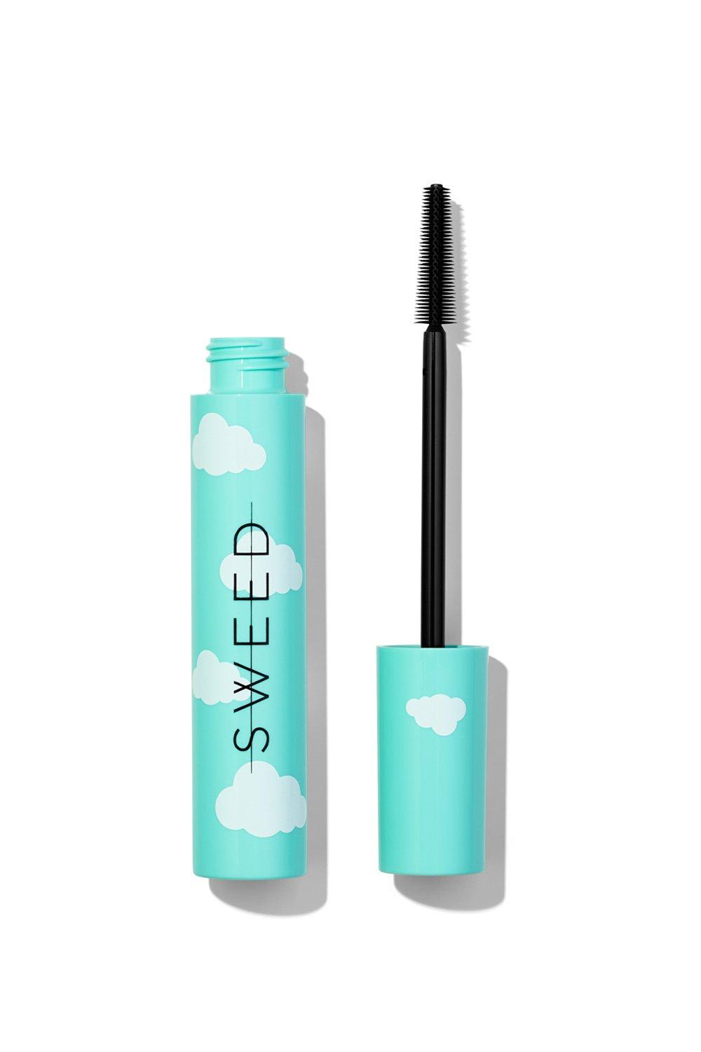 Turquoise mascara tube with cloud designs and "SWEED" branding, featuring a black, bristle mascara wand beside it.