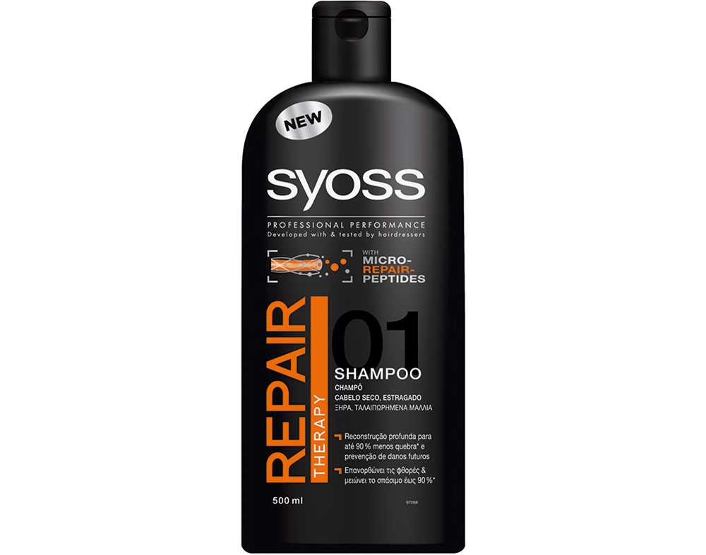 Black bottle of Syoss Repairing Shampoo, 440 ml, featuring bold orange text, "REPAIR," and "01 SHAMPOO," with a sleek, professional design and a new product label.
