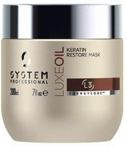 Gold and silver jar of System Professional LuxeOil Keratin Restore Mask, 200 ml, featuring a sleek design with a black and brown label indicating its keratin restoration properties.
