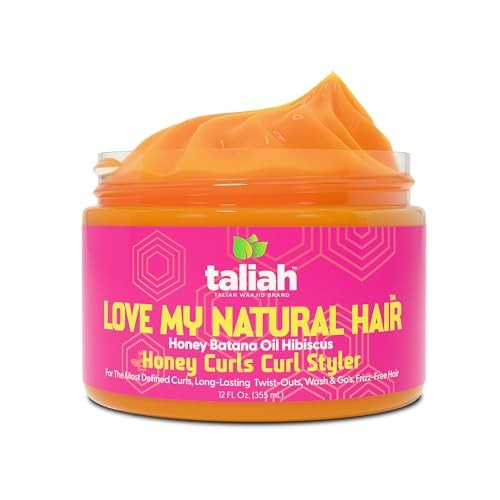 Bright orange curl defining cream in a clear jar with a pink label, featuring the text "LOVE MY NATURAL HAIR" and branding by Taliah Waajid, highlighting moisturizing and frizz-control properties.