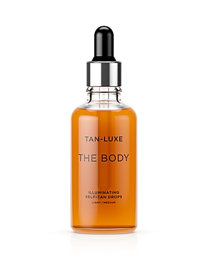 Tan-Luxe the Body Illuminating Self-Tan Drops in a clear glass bottle with a black dropper, featuring a light amber liquid and minimalist black text on the label.