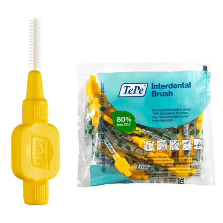 Yellow TePe interdental brushes in a clear packaging, featuring a textured handle and a thin, flexible bristle head, designed for cleaning between teeth.