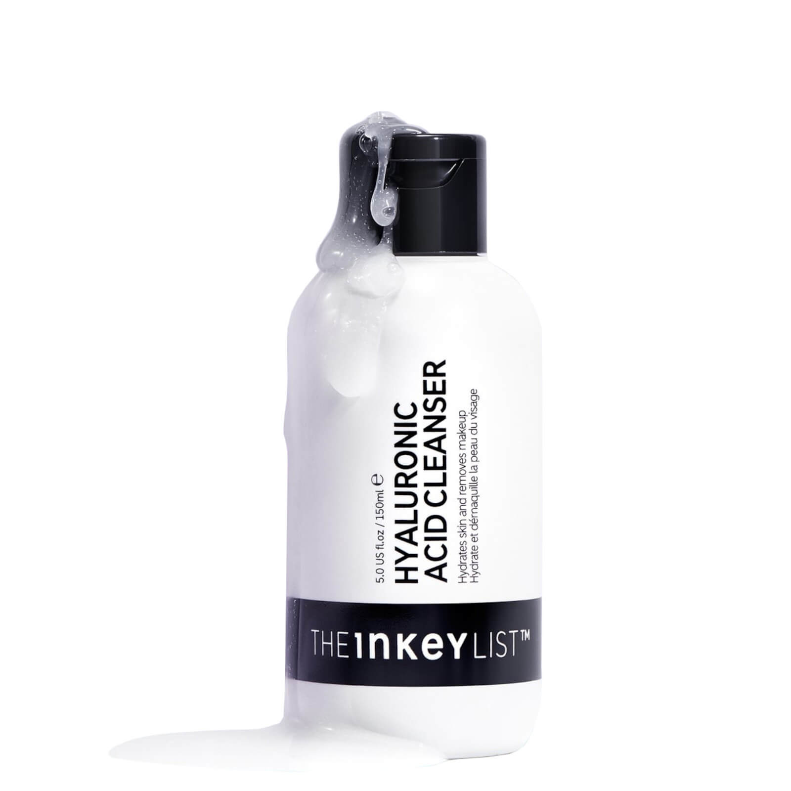 White bottle of The Inkey List Hyaluronic Cleansing Solution, featuring a black cap and label, with a clear gel-like cleanser dripping from the top.