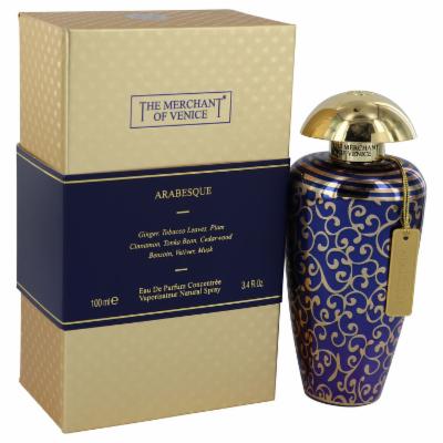 Blue and gold decorative bottle with a gold cap, featuring intricate arabesque patterns, beside a matching box labeled "Arabesque" by The Merchant of Venice, 3.4 oz.