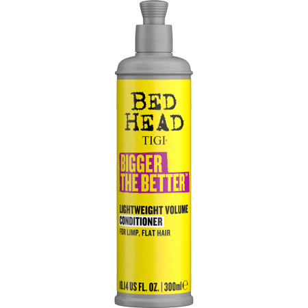 Bright yellow spray bottle with a silver cap, labeled "BED HEAD TIGI BIGGER THE BETTER," designed for lightweight volume conditioning for limp, flat hair, containing 300ml.