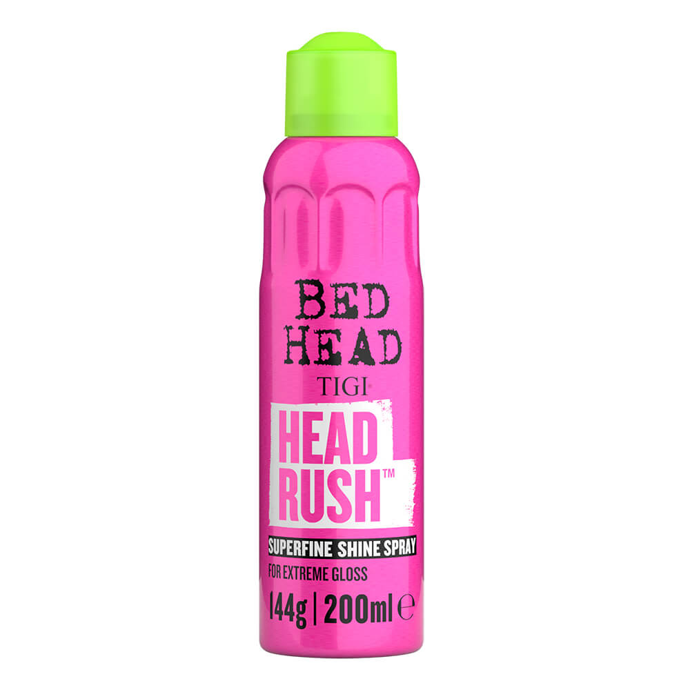 Bright pink spray bottle with a green cap, labeled "BED HEAD Tigi HEAD RUSH Superfine Shine Spray 200ml," designed for adding extreme gloss to hair.