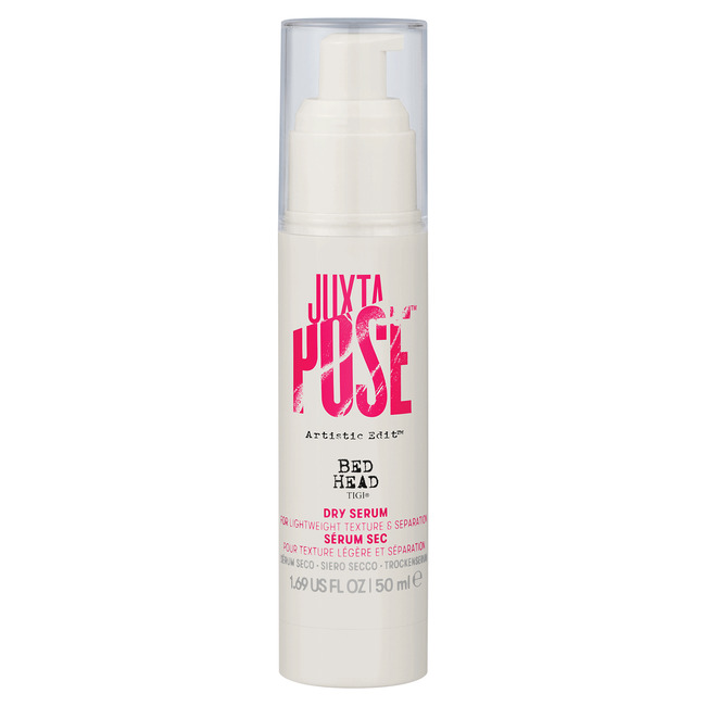 Tigi Bed Head Juxta Pose Dry Serum in a clear pump bottle with a pink and white label, featuring bold text and a sleek design, 50 ml size.