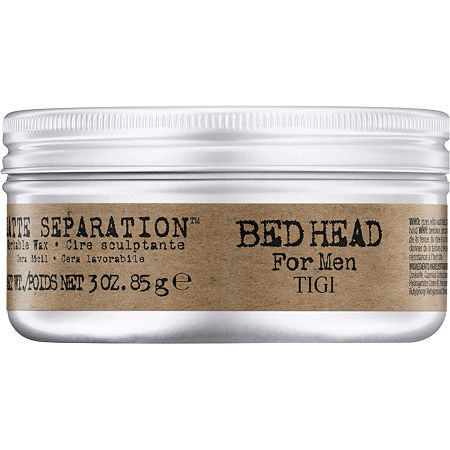 Silver metal container with a screw-top lid, labeled "BED HEAD For Men" in bold text, featuring a matte finish and a brown paper label detailing product information.