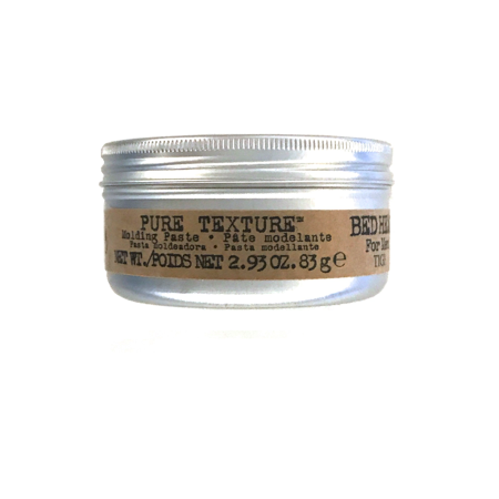 Gold packaging container of Bed Head Men by Tigi PURE TEXTURE MOLDING PASTE, 2.93 oz, featuring a silver lid and clear label with product details.