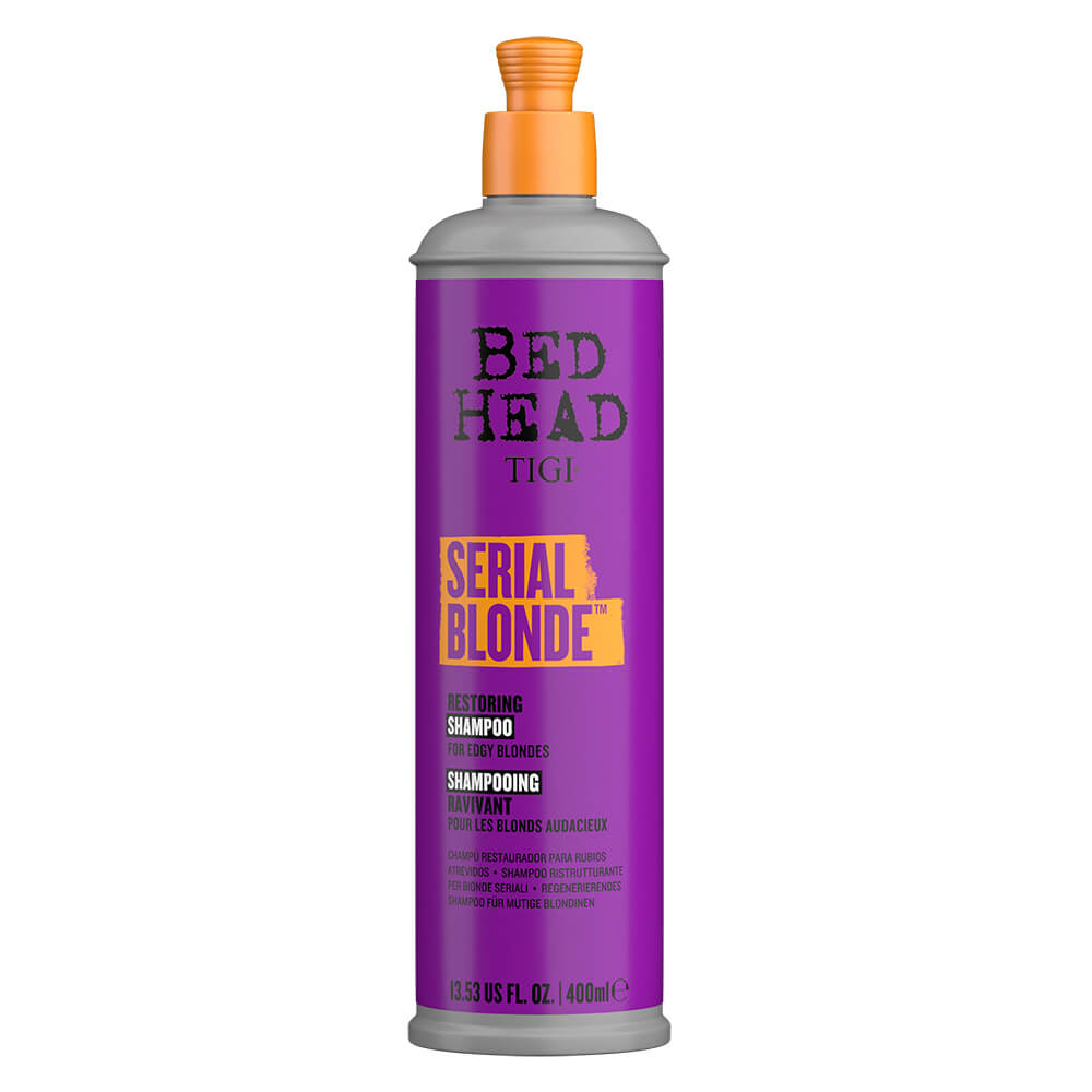 Purple shampoo bottle with a sleek design, featuring a gray cap and bold yellow text reading "Serial Blonde" on a vibrant purple background, labeled as 400 ml.