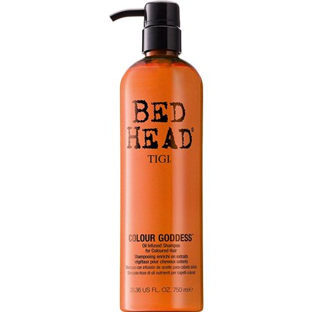 Tigi Bed Head Colour Goddess Shampoo in a tall, amber plastic bottle with a black pump, labeled in bold white and pink text, designed for colored hair, 750ml.