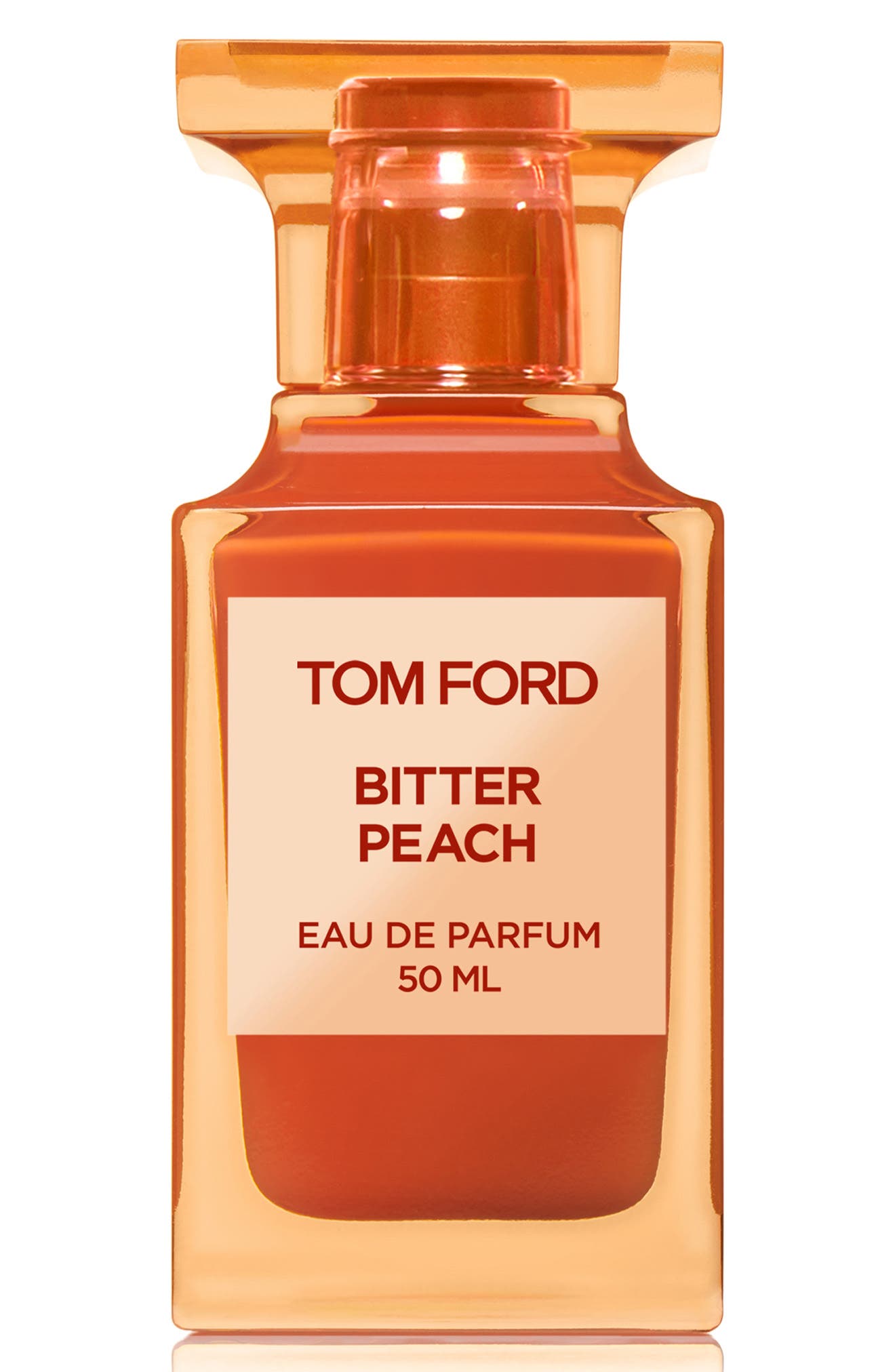 Clear glass bottle with a peach-colored liquid, featuring a bold orange cap and a label that reads "TOM FORD BITTER PEACH EAU DE PARFUM 50 ML."