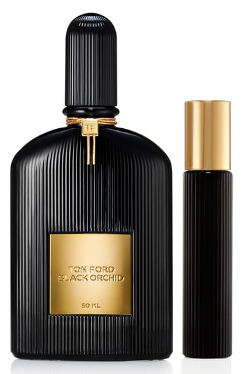 Black Orchid gift set featuring a 50ml black glass bottle with ribbed texture and gold accents, alongside a 10ml matching travel-sized EDP.