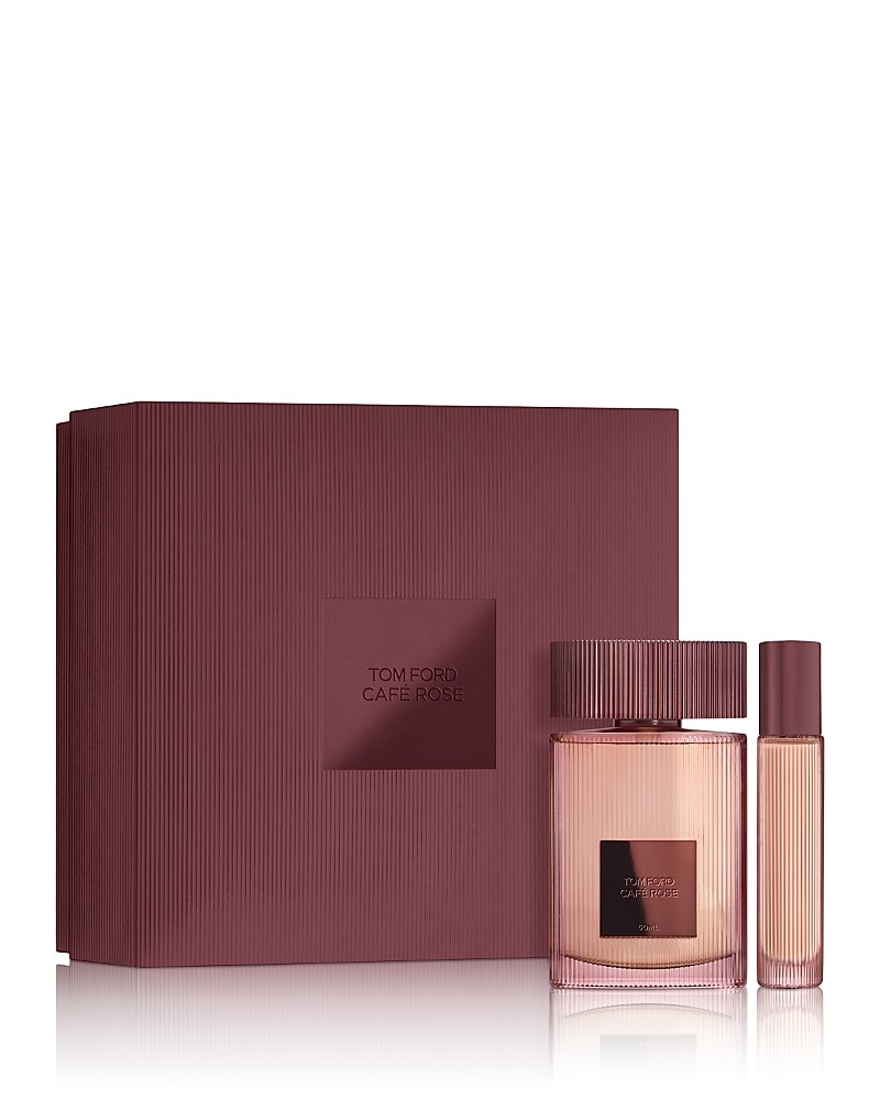 Elegant burgundy gift box containing a Tom Ford Cafe Rose Eau De Parfum bottle and a travel-sized spray, both featuring sleek glass designs with minimalist labels.