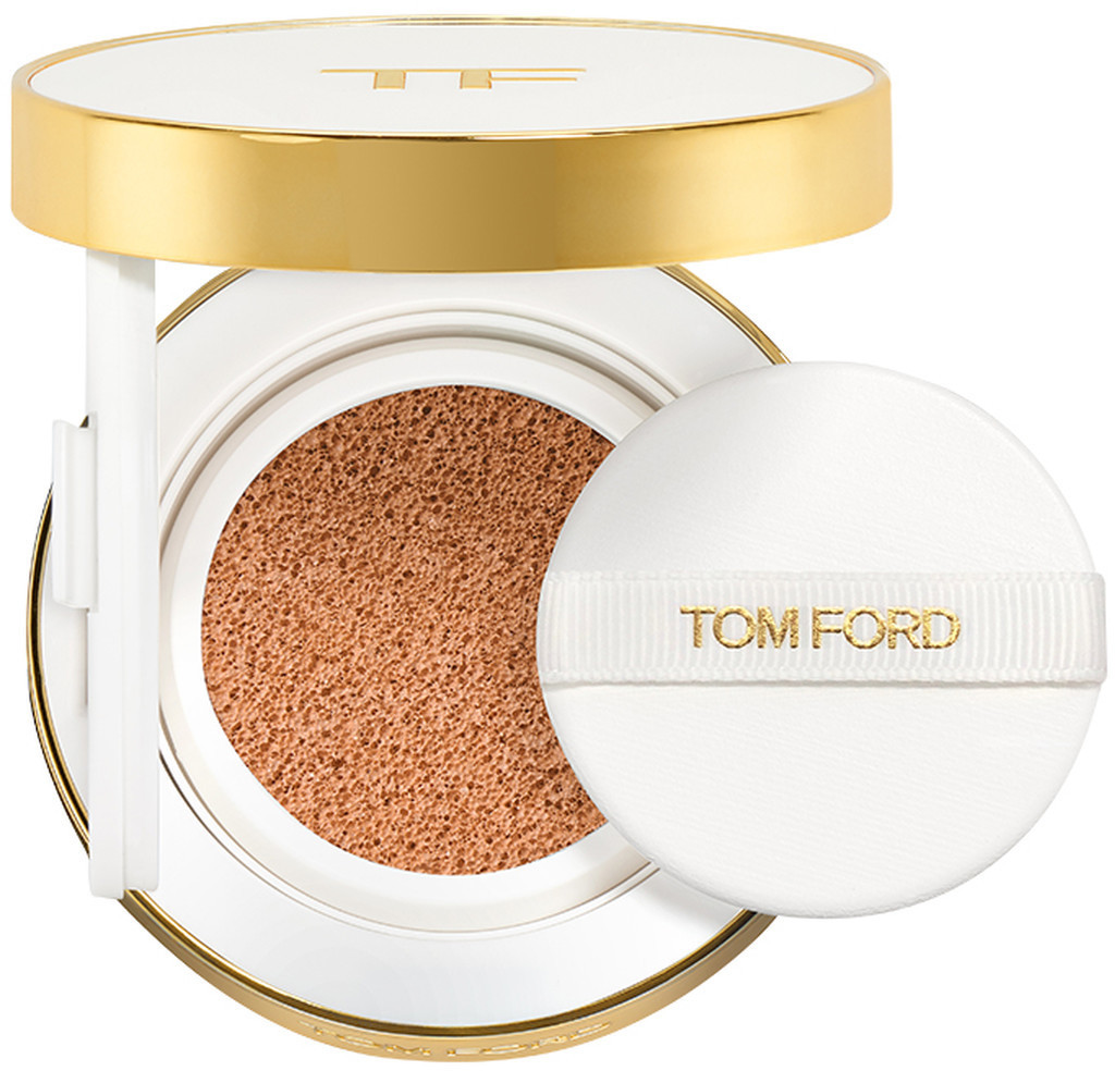 Compact foundation in a sleek white and gold case, featuring a deep bronze shade, SPF 40, and a refillable design, accompanied by a white applicator puff embossed with "TOM FORD."