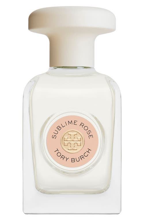 Clear glass bottle with a round white cap, featuring a pink label that reads "Sublime Rose" and "Tory Burch," showcasing a minimalist and elegant design.