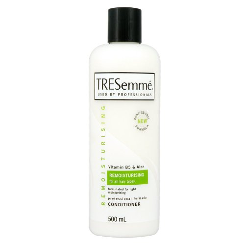 White bottle of TRESemmé Remoisture Conditioner, featuring a green label, 500 mL size, and key ingredients like Vitamin B5 and Aloe, designed for all hair types.