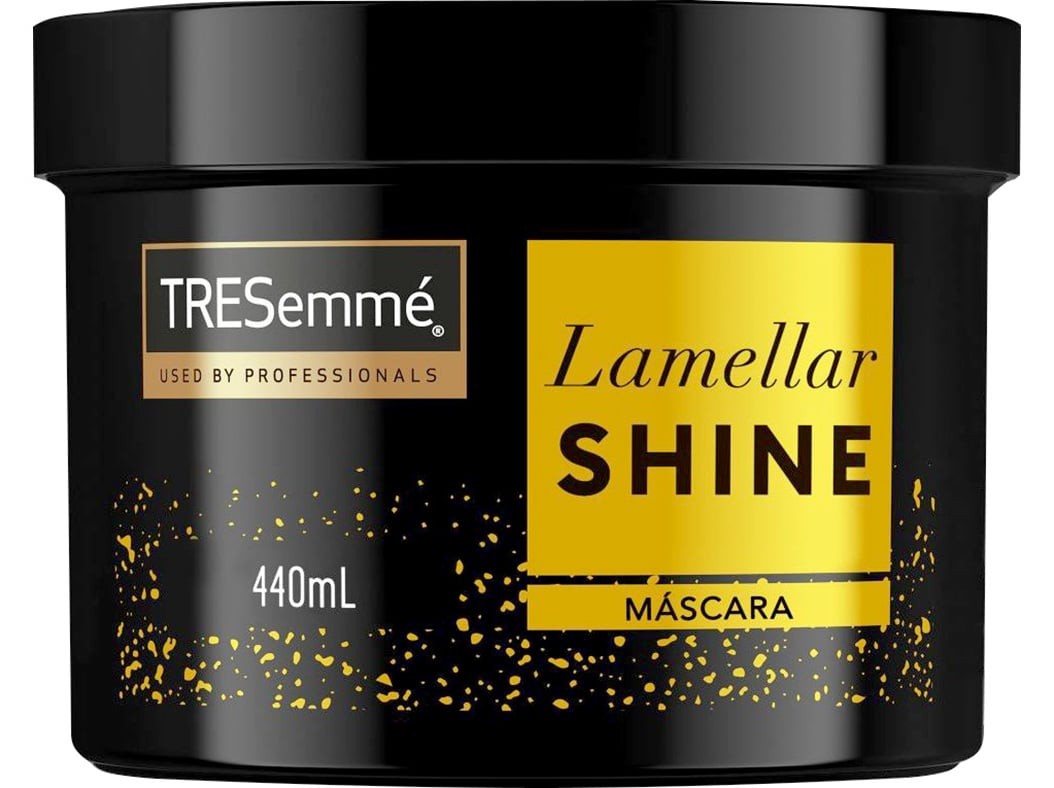 Black container of TRESemmé Lamellar Shine Hair Mask, featuring a yellow label with bold text, and a glittery design, indicating 440 mL of product for shiny and soft hair.