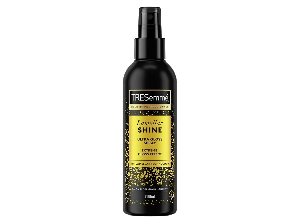 Black spray bottle with a glossy finish, featuring a gold label that reads "TRESemmé Lamellar Shine Ultra Gloss Spray," 200ml, designed for heat protection and shine enhancement.