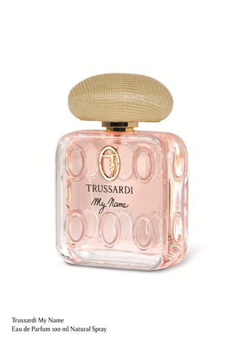 Clear glass bottle with a rounded shape, featuring a textured gold cap and a pink liquid inside, labeled "Trussardi My Name" in elegant font.