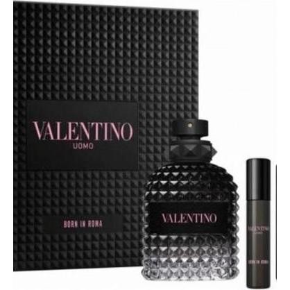 Black gift box featuring a textured design, containing a large crystal-like bottle of Valentino Uomo Born in Roma Eau De Toilette (100 ml) and a smaller spray (10 ml).