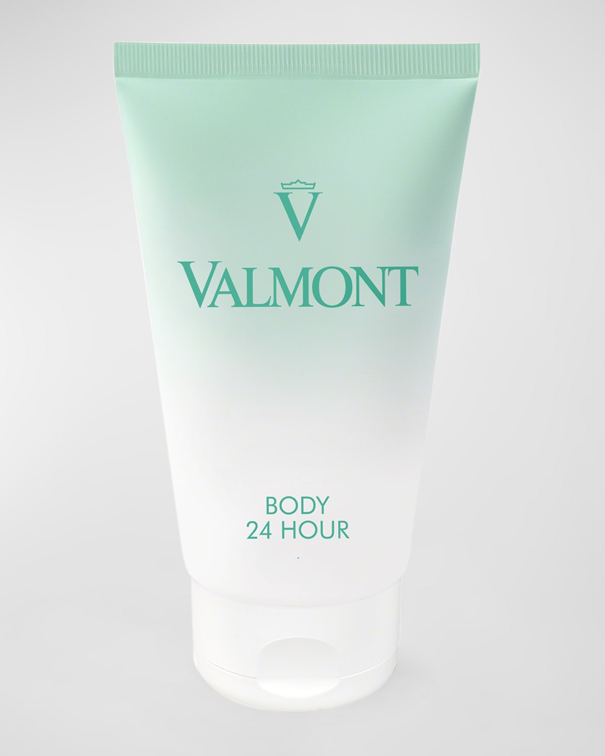 Light green and white tube of Valmont Body 24 Hour anti-aging moisturizing cream, featuring a prominent logo and text, with a sleek, modern design.