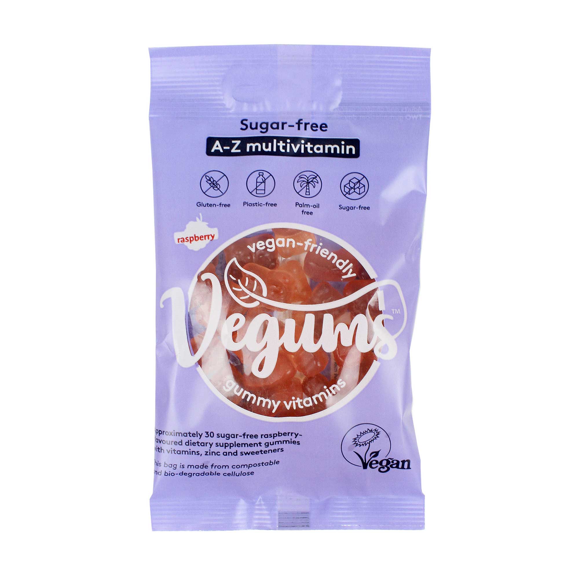 Purple packaging featuring "Vegums" logo, with a clear window showcasing raspberry-flavored, sugar-free multivitamin gummies; labeled as gluten-free and vegan-friendly.