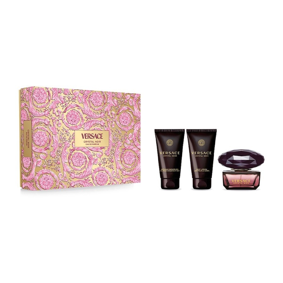 Versace Crystal Noir Women's Gift Set featuring a luxurious purple bottle, two dark tubes, and an ornate pink and gold box with floral patterns.