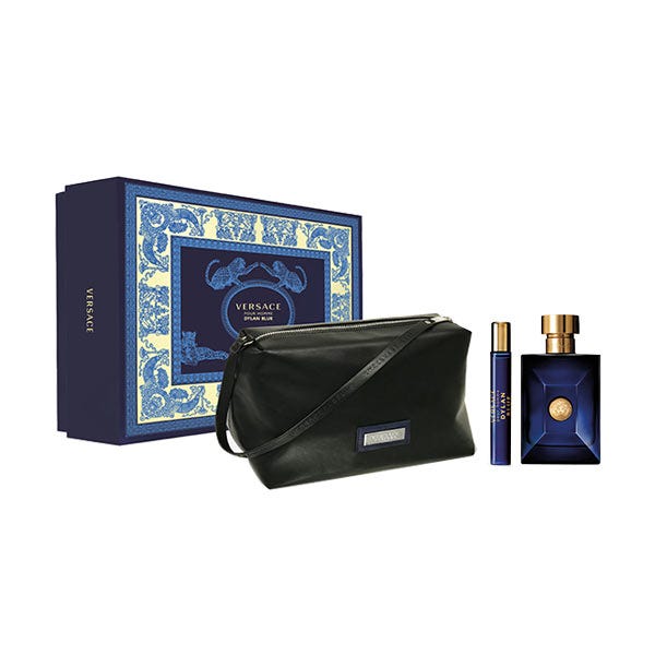 Versace Dylan Blue Beauty Premium Box features a navy blue box with ornate blue and gold detailing, a sleek black pouch, a 100 ml EDT bottle, and a 10 ml travel-sized EDT.