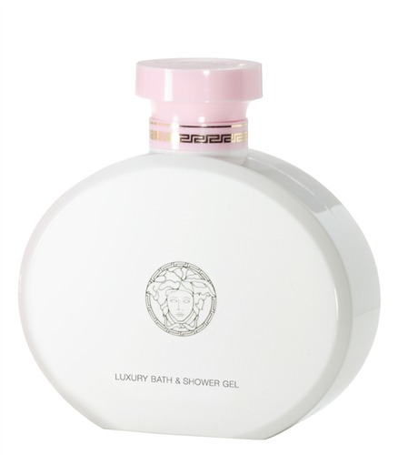White oval bottle with a pink cap, featuring a gold and pink label, embossed with a classic Versace motif and the text "LUXURY BATH & SHOWER GEL."
