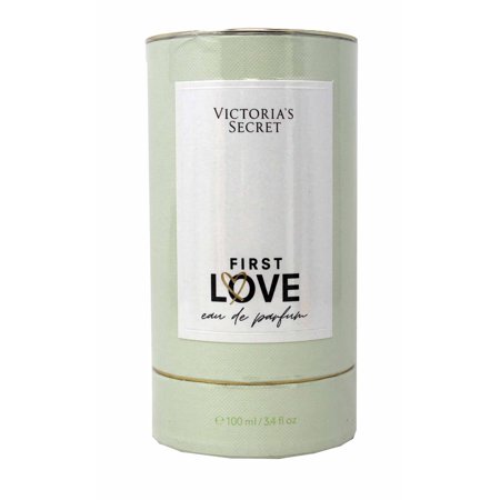 Light green cylindrical box with a white label featuring "Victoria's Secret First Love" in bold black letters, indicating 100 ml of eau de parfum.