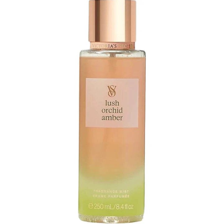 Clear glass bottle with a gradient from peach to green, featuring a gold label that reads "lush orchid amber" and the Victoria's Secret logo, containing 250ml of fragrance mist.