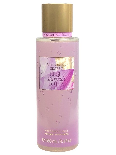 Clear bottle of Victoria's Secret Lush Starfruit Lotus Body Mist, featuring a pink liquid, gold cap, and a purple label with the product name and volume.