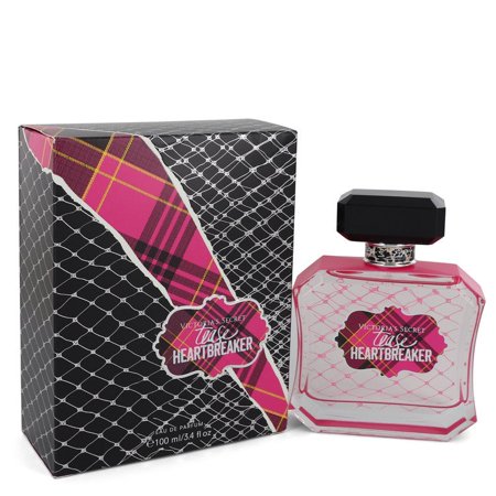 Clear glass bottle with a pink tint, featuring a black cap, next to a patterned box in pink, black, and white with a plaid design and "Tease Heartbreaker" label.
