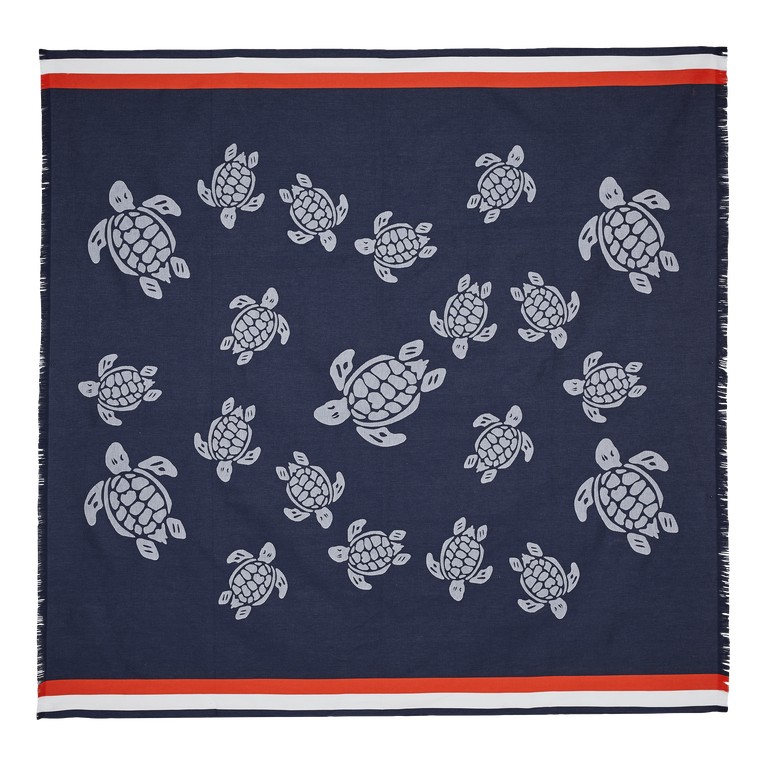 Large blue towel featuring a pattern of gray turtles, bordered with red and white stripes, made from soft, absorbent material, ideal for beach or pool use.