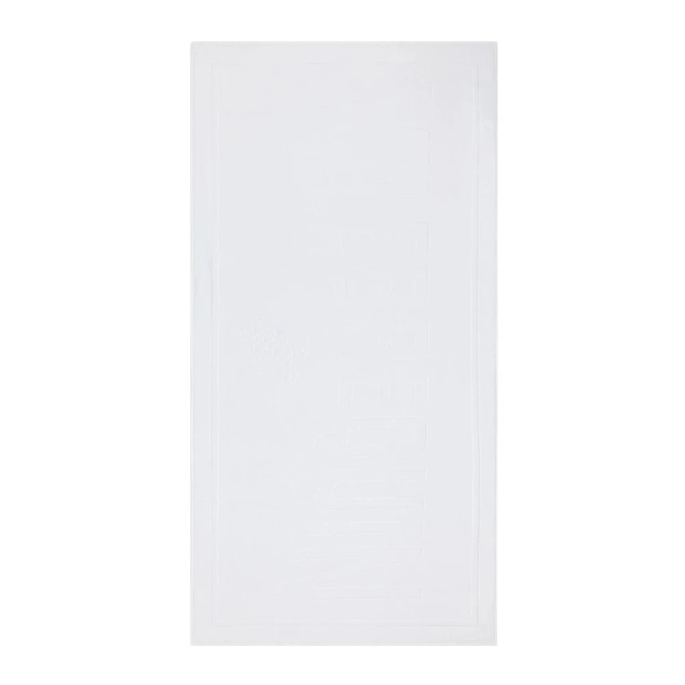 Solid white beach towel made of organic cotton, featuring a textured design, measuring OSFA, ideal for sand use.