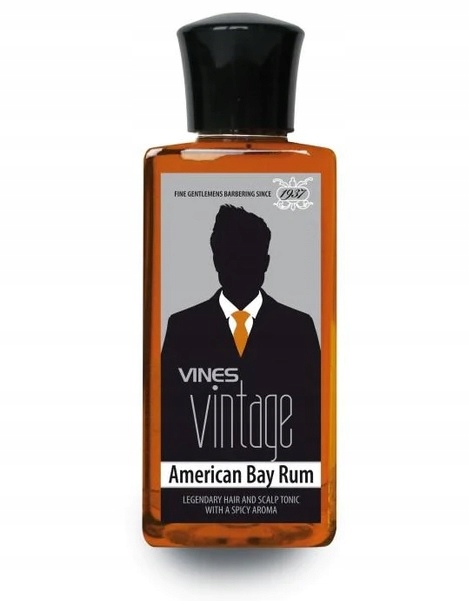 Amber-colored bottle of Vines Vintage American Bay Rum Hair Tonic, featuring a black cap and a label with a silhouette of a man in a suit, emphasizing its vintage appeal.
