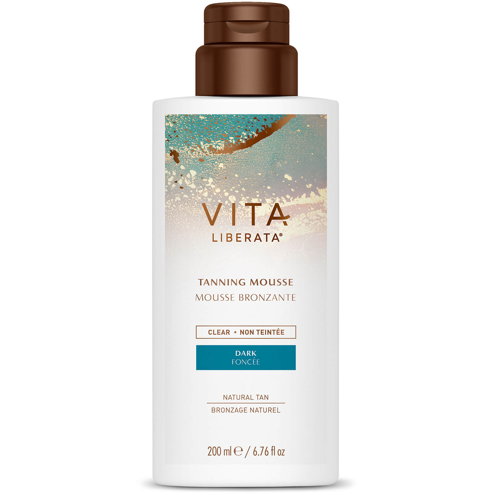 White bottle with a brown pump top, featuring a colorful label that reads "Vita Liberata Tanning Mousse Clear Dark 200 ml" in stylish font, highlighting its natural tanning properties.