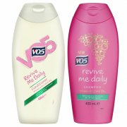 Two bottles of VO5 Revive Me Daily Shampoo and Conditioner, 400ml each; the shampoo is pink with gold accents, and the conditioner is white with green labeling.