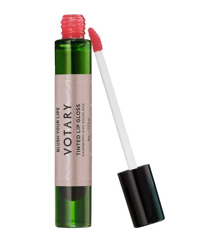 Tinted lip gloss in a clear green tube with a black cap, featuring a pink raspberry shade and a doe-foot applicator for easy application.