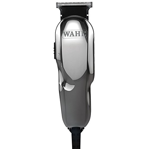 Shiny chrome trimmer with a T-blade, featuring a black power switch and textured grip, designed for precision cutting and detailing in professional grooming.