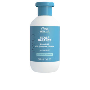 Wella Invigo Scalp Balance Shampoo in a white bottle with a turquoise cap, featuring a label that highlights its anti-dandruff formula with lotus extract, 300ml size.