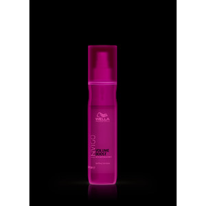 Wella Invigo Volume Boost Uplifting Care Spray in a sleek, transparent pink bottle with a pump dispenser, designed to enhance hair volume and texture.