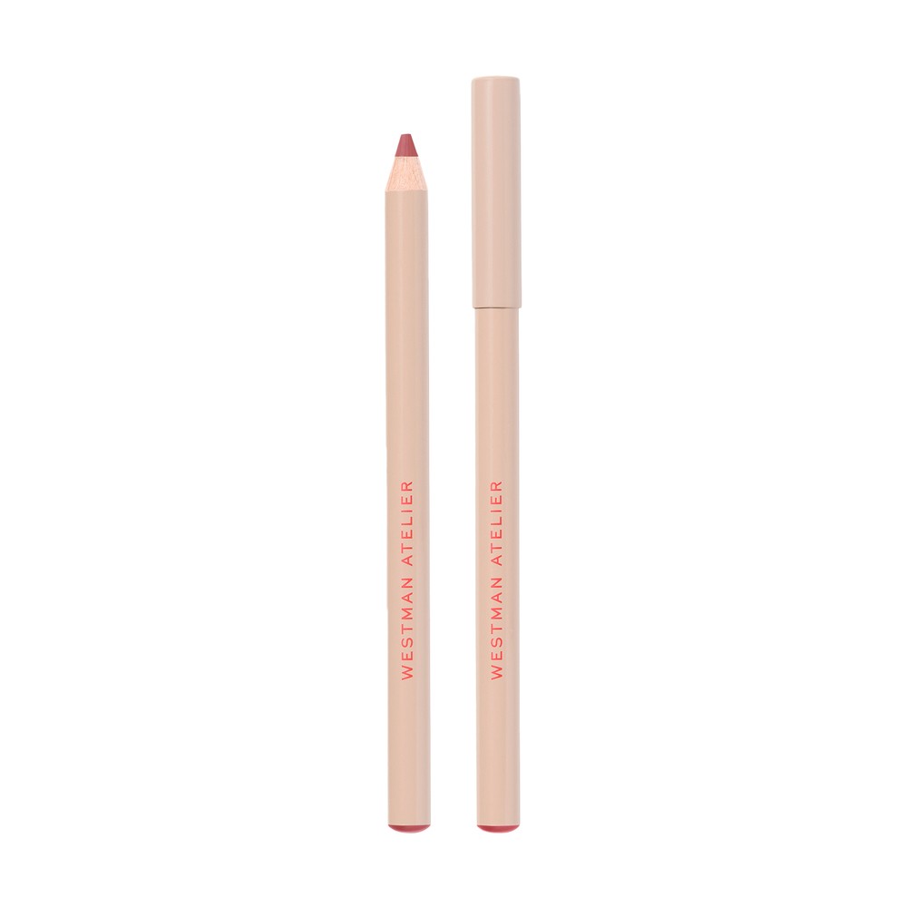 Lip Shade Lip Liner in "Je Reve" by Westman Atelier, features a slim pencil design with a soft pink hue and a nude casing, showcasing the brand name in elegant lettering.
