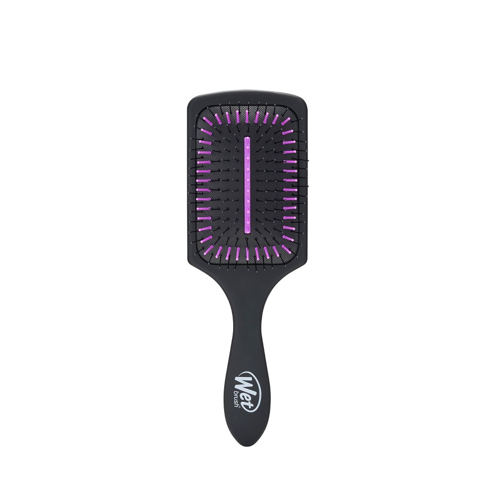 Charcoal-infused paddle hair brush with a black body, purple bristles, and a comfortable grip handle, designed for detangling and reducing static.