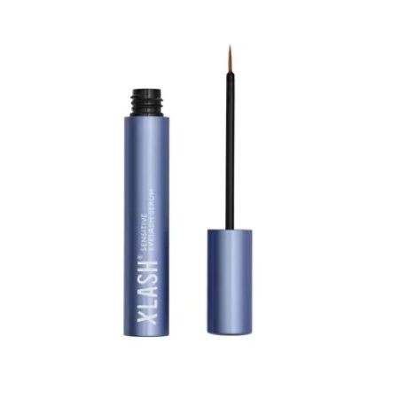 Xlash Sensitive Eyelash Serum in a sleek blue tube with a black applicator wand, designed to enhance lash growth and strength.