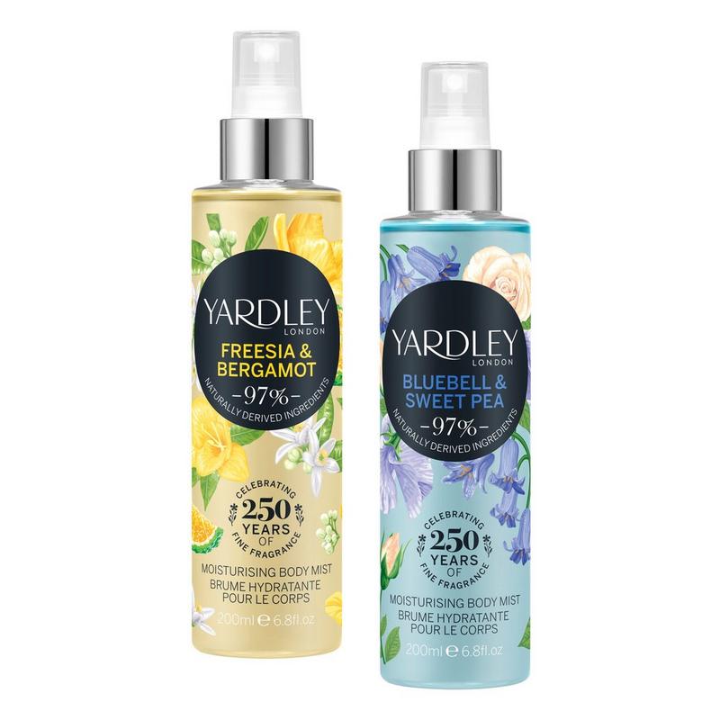 Two transparent spray bottles of Yardley body mist, one labeled "Freesia & Bergamot" and the other "Bluebell & Sweet Pea," featuring floral designs and a 6.8 oz capacity.